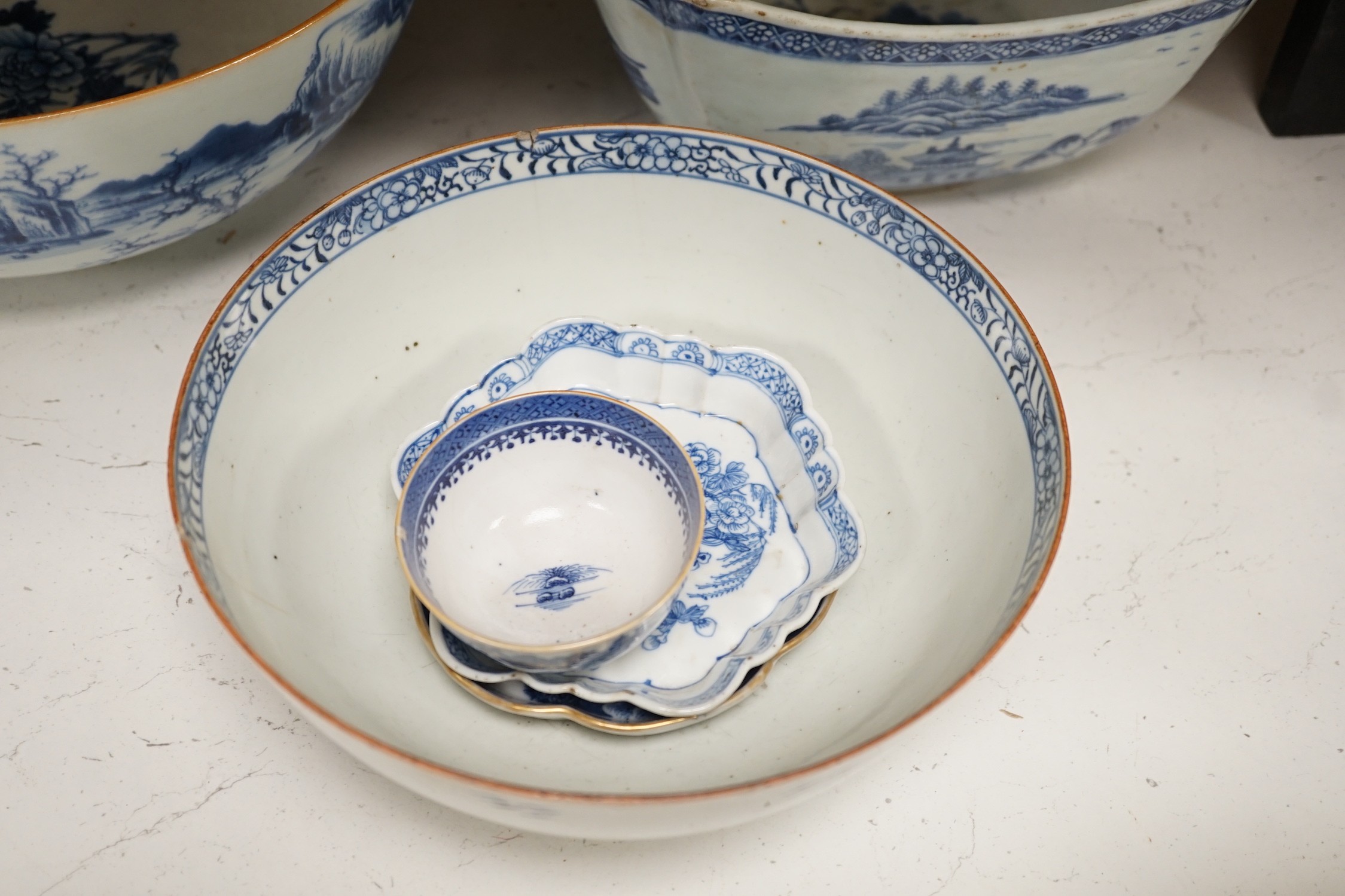 A selection of 18th century blue and white Chinese export bowls and dishes, largest 31cm diameter